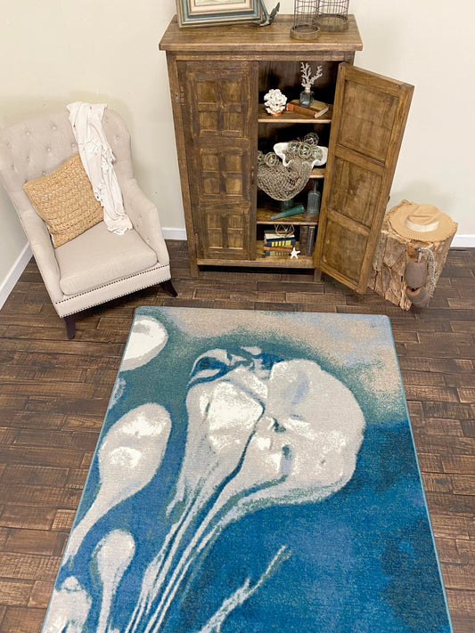 Overhead room scene of Abstract Jellyfish - Ocean Blue coastal area rug. 